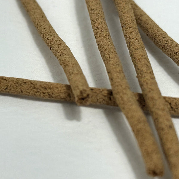 Close-up of brown costus incense sticks